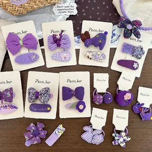Süßes lilafarbenes Haarspangen-Set mit Stoffbögen und Blumenmustern für Kinder