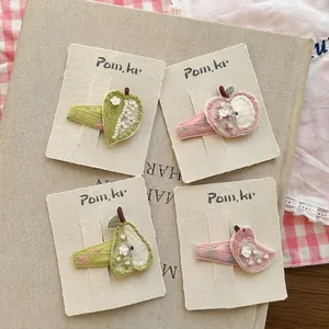 Handmade embroidered hair clips set for girls featuring fruit designs and pearls