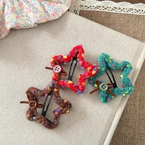 Three-piece set of star-shaped knitted hair clips with wooden buttons and leather bows