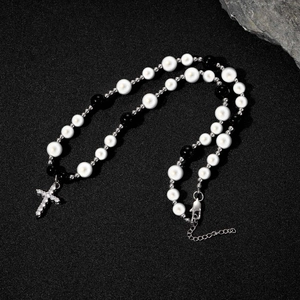 Hip hop necklace with white pearls, black beads, and a crystal-set cross pendant