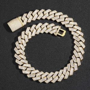 Macro detail of 20mm wide gold Cuban link chain with square and round zircon pavé