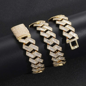Detailed macro view of 20mm baguette and round cut zircon encrusted gold Cuban link chain