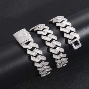 Macro shot of 20mm wide Cuban link chain with dense zircon stones and secure box clasp