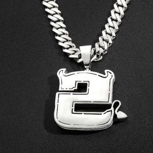 Close-up of hip hop silver devil number 2 pendant with zirconia on cuban chain necklace