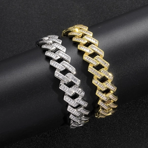 Macro detail of 16mm iced out Cuban chain bracelet with silver and gold plating