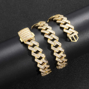 Detail of 16mm gold hip hop Cuban chain with baguette-cut zircon stones on a black display