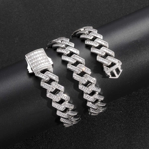 Detail of 16mm silver Cuban link necklace featuring iced out baguette and round zircons