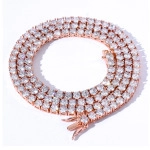 Macro detail of rose gold tennis chain with pavé-set cubic zirconia in spiral display