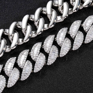 Detailed macro view of 20mm Cuban link bracelet with baguette and round cut zircon stones
