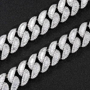 Macro detail of 20mm silver Cuban link chain with T-shape and round zircon inlays