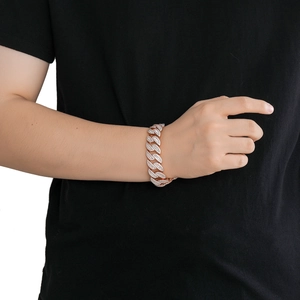 Close-up of 20mm rose gold Cuban link bracelet with square zirconia stones on wrist