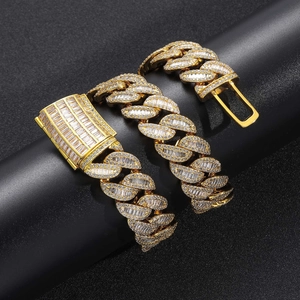 Macro shot of 20mm gold Cuban chain featuring heavy T-square zircon paved clasp