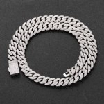 Detail view of iced out silver Cuban link chain with white zircons and rectangle clasp