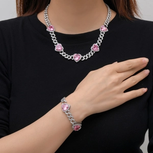 Cuban chain jewelry set with silver paved zircon and pink heart stones on model
