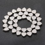 Detailed view of silver heart-shaped link necklace with sparkling rhinestone inlay