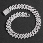 Detailed view of silver iced out Cuban link chain with micro-paved cubic zirconia stones
