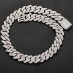 Detail of silver iced out Cuban link chain featuring a box clasp and zircon stones