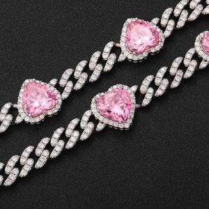 Close-up of hip hop Cuban chain with silver pave diamonds and pink heart zircon stones