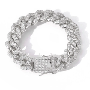 Close-up of a 16mm cuban link chain featuring baguette-cut zircon stones and safety clasp