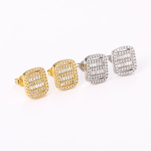 Detail of square hip-hop stud earrings featuring gold and silver pave set zircon stones