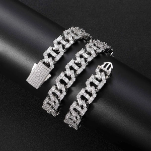 Close-up of 13mm iced out Cuban chain with square diamonds and box clasp detail