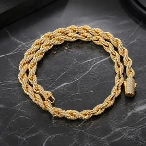Close-up of iced out golden rope chain bracelet with micro-paved sparkling cubic zirconia