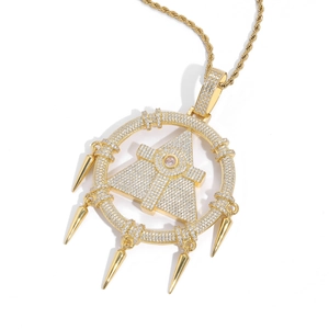 Detailed close-up of a hip-hop gold necklace with pyramid pendant and pink gemstone