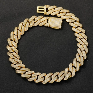 Detailed view of 20mm gold Cuban link chain with three rows of cubic zirconia stones