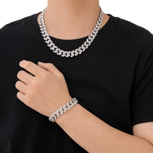 Close-up of hip hop silver Cuban link necklace and bracelet set with pave zircon stones