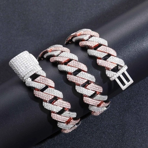 Detail of 20mm two-tone Cuban link necklace with pave-set zircons on a display stand