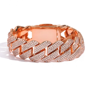 Detailed close-up of rose gold Cuban link bracelet with sparkling pave zircon stones