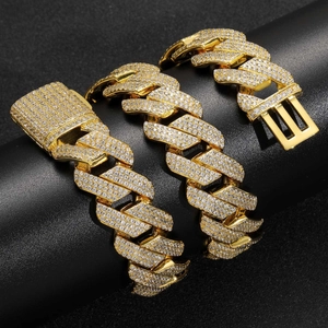 Close-up of 20mm gold Cuban link necklace featuring three rows of sparkling zircon stones