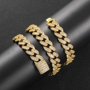 Detail of 15mm gold Cuban link chain with baguette-cut zircons and iced-out buckle