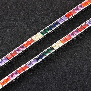 Macro detail of rainbow princess cut square zircon tennis necklace with silver setting