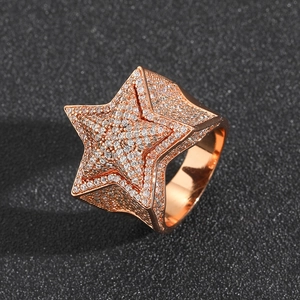 Detailed view of 3D star ring in rose gold with pave-set cubic zirconia stones