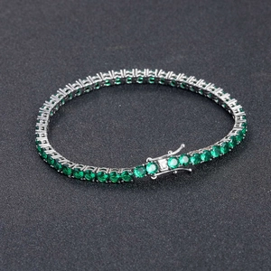 Macro shot of 4mm green zircon tennis chain with silver plating and secure clasp
