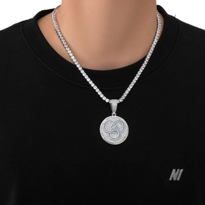 Detail of hip hop round medallion pendant with blue enamel and micro-pave zircons