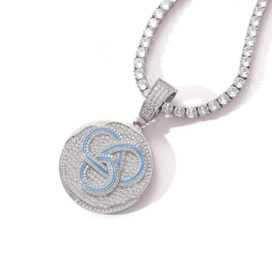 Macro shot of hip-hop round pendant with blue geometric inlay and tennis chain diamonds