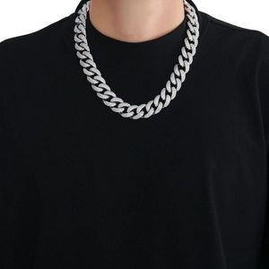 Close-up of 18mm heavy Cuban link chain with three-row cubic zirconia on a male model