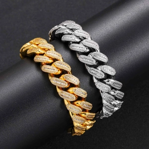 Detail of gold and silver hip hop Cuban link necklaces with shimmering T-square zircons