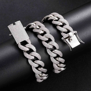 Detail of 18mm silver Cuban link chain featuring heavy micro-pave cubic zirconia on clasp
