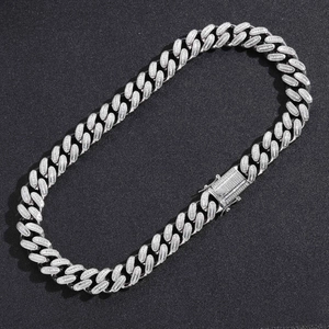 Detailed macro shot of 18mm silver plated Cuban link chain with icy pave set zircons