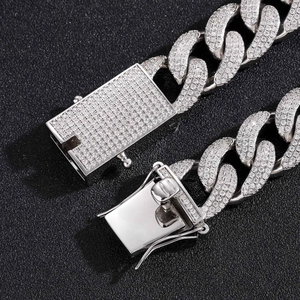 Macro shot of 18mm silver cuban link chain with zircon micro-paving and rectangle clasp