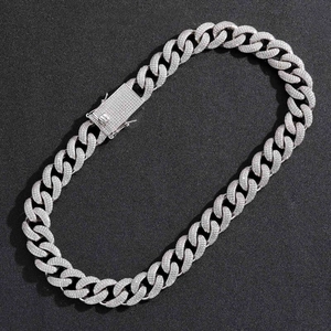 Detailed macro view of 18mm silver Cuban link chain with pave-set sparkling zircon stones