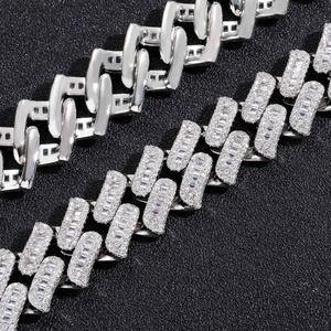 Macro detail of 16mm silver Cuban link chains with Baguette zircon and thorn design