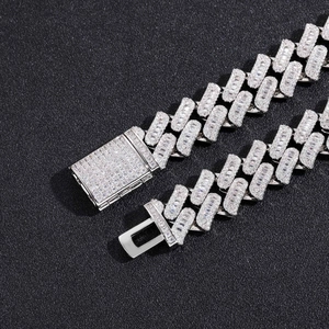 Macro shot of 16mm silver Cuban link chain with icy square zircon paving and box clasp