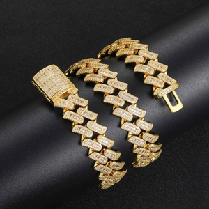 Detailed macro view of 16mm gold-plated Cuban chain with sparkling baguette zircons