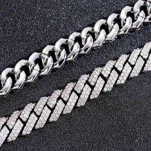 Macro detail of 925 silver Cuban link chain with polished and iced out moissanite links