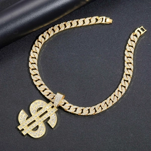 Macro shot of Cuban link chain with a sparkling crystal dollar sign pendant for men