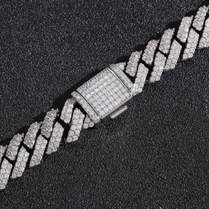 Macro detail of 925 silver 10mm Moissanite rhombic Cuban chain with iced out buckle